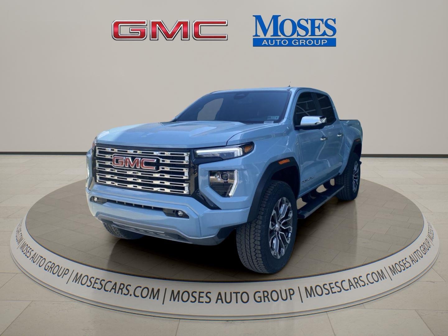 2026 GMC Canyon Denali in Glacier Metallic — front three-quarter view